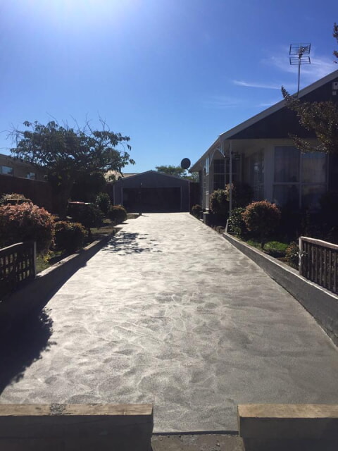 Driveway replacement, plain finish with swirl pattern for looks.
