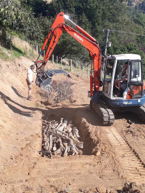 the beds have been excavated, now they are filled with logs and branches which break down and supply nutrition to the herb garden