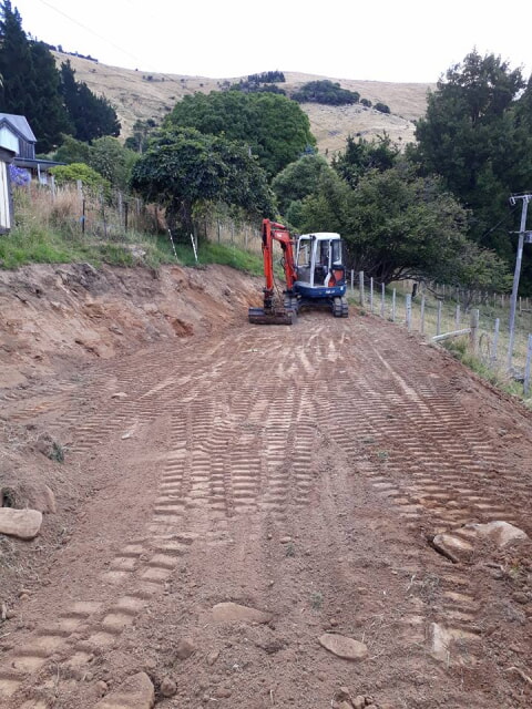 Hill side cut away, next we excavate the beds for the trees and logs to sit in