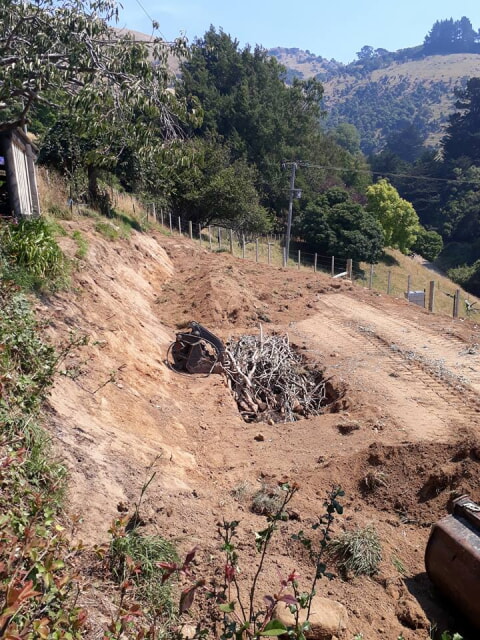 beds filled, and covered in topsoil we seperated before we cut the hillside
