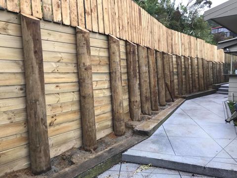 Timber pole retaining wall,  Dyres road, Port hills - Cashmere 