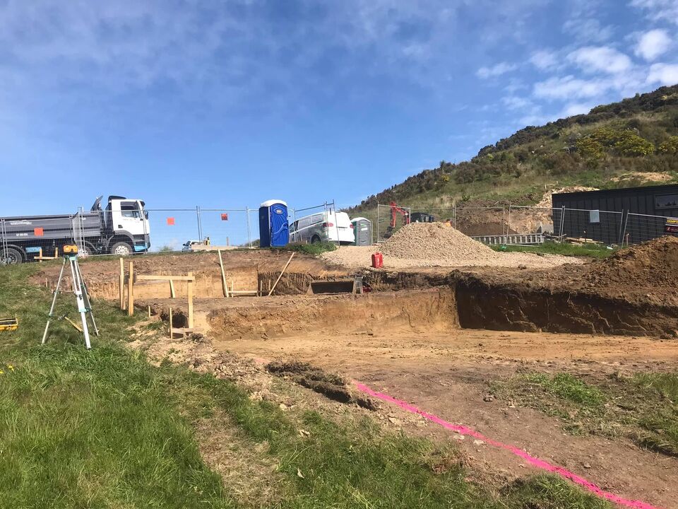 Excavator working on a difficult Port Hills site in Christchurch
